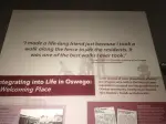A picture of a museum plaque that reads, "I made a life-long friend just because I took a walk along the fence to see the residents. I twas one of the best walks I ever took."